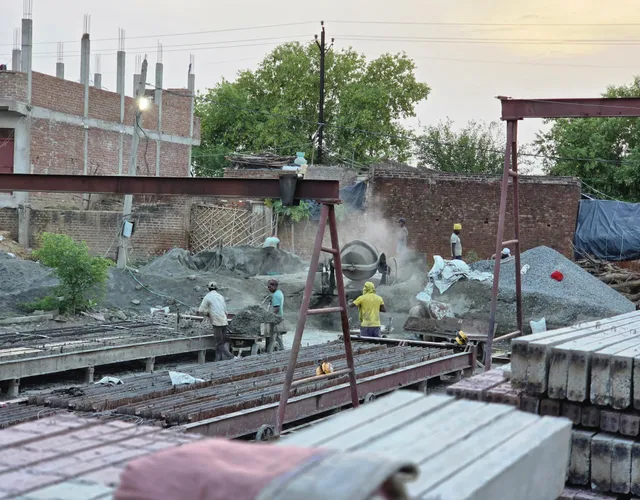 Mansi Ganga poles on a construction site